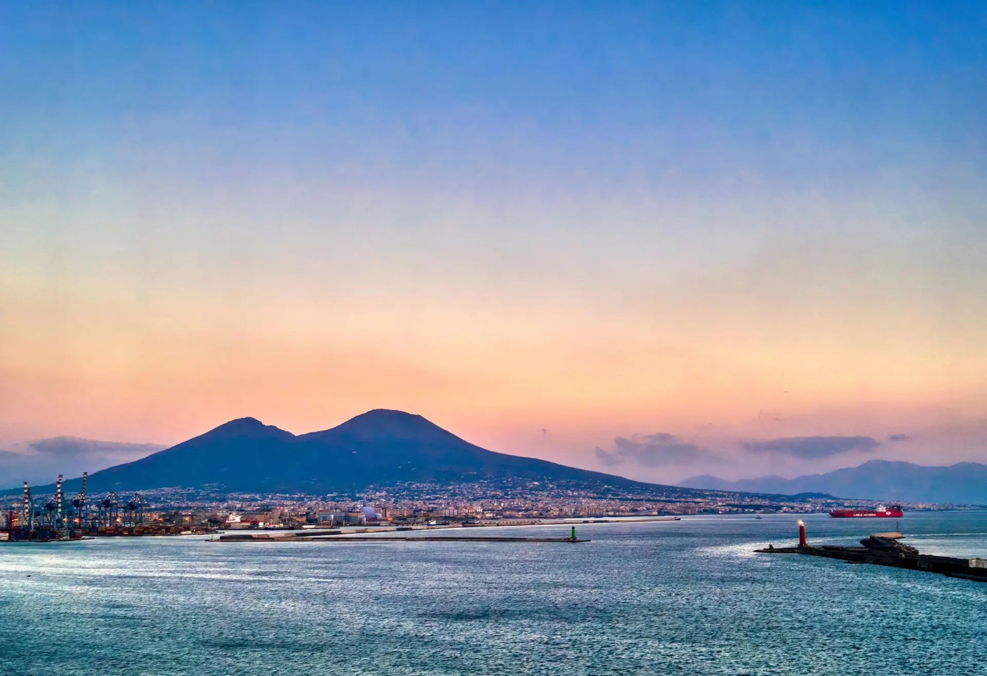 Mount Vesuvius at golden hour across the Bay of Naples